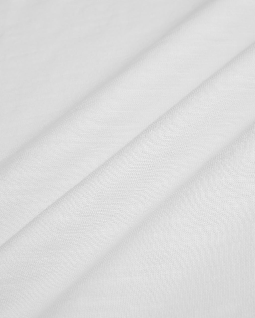 Close up of the 170gsm white cotton slub fabric