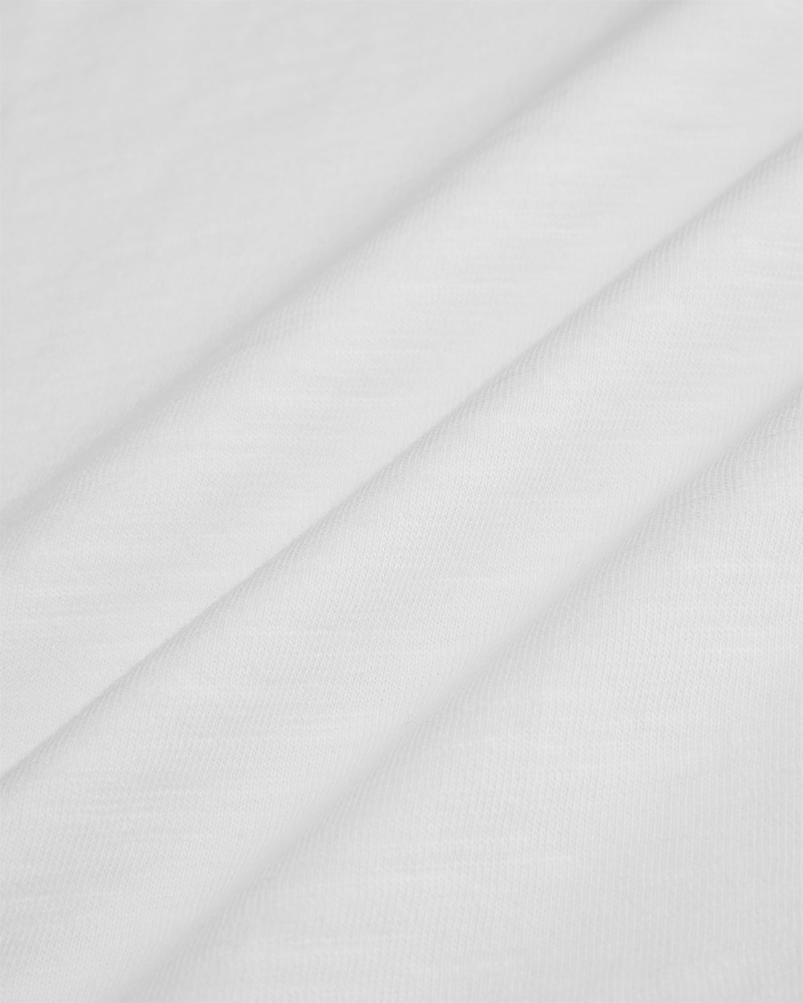 Close up of the 170gsm white cotton slub fabric