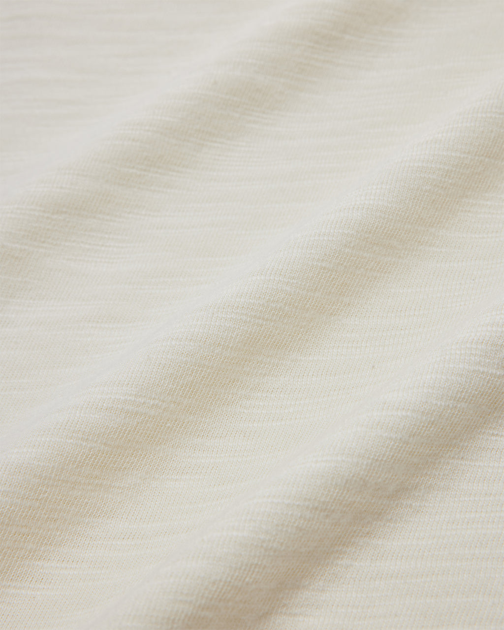 Close up of the 190gsm off-white cotton slub fabric