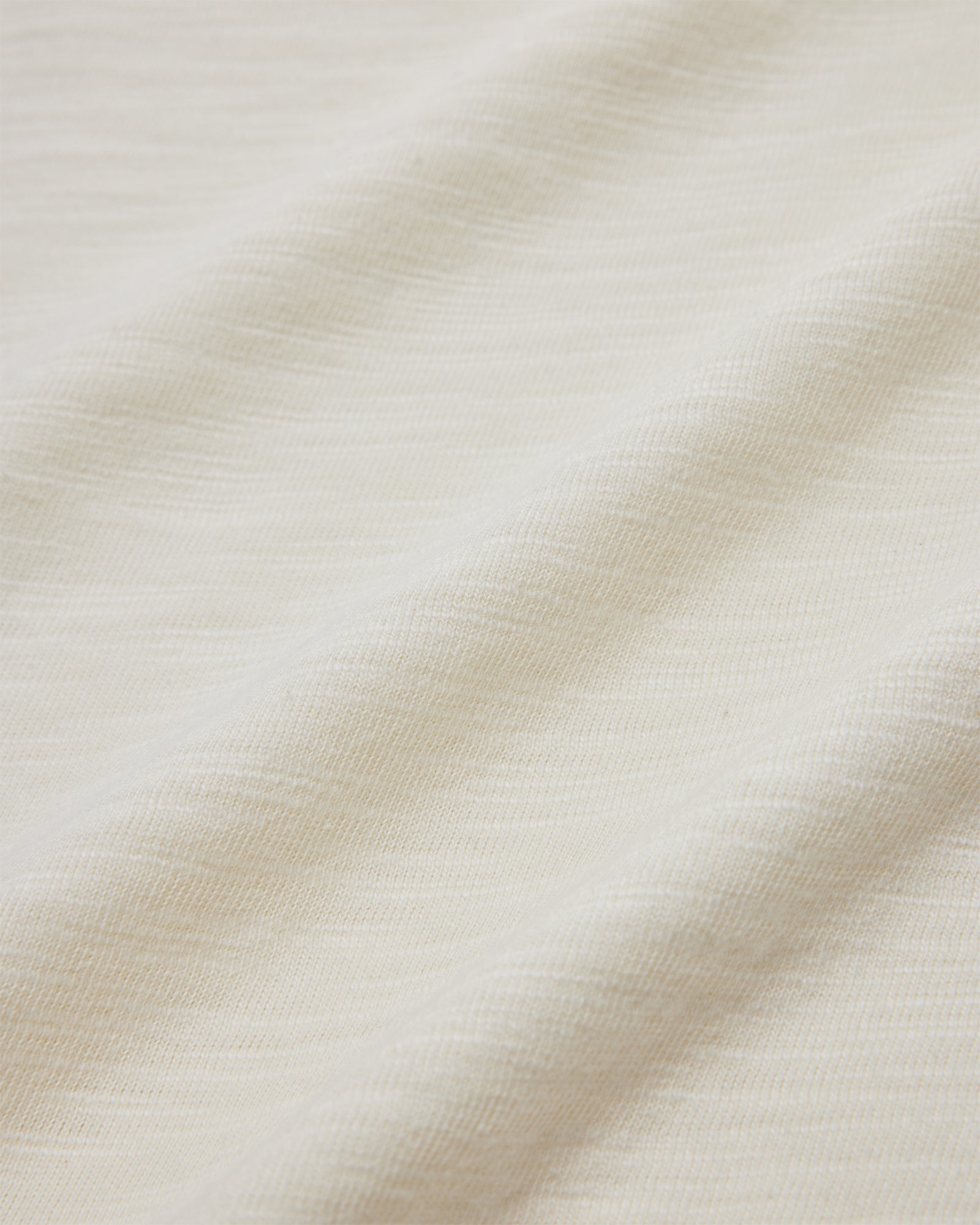 Close up of the 190gsm off-white cotton slub fabric