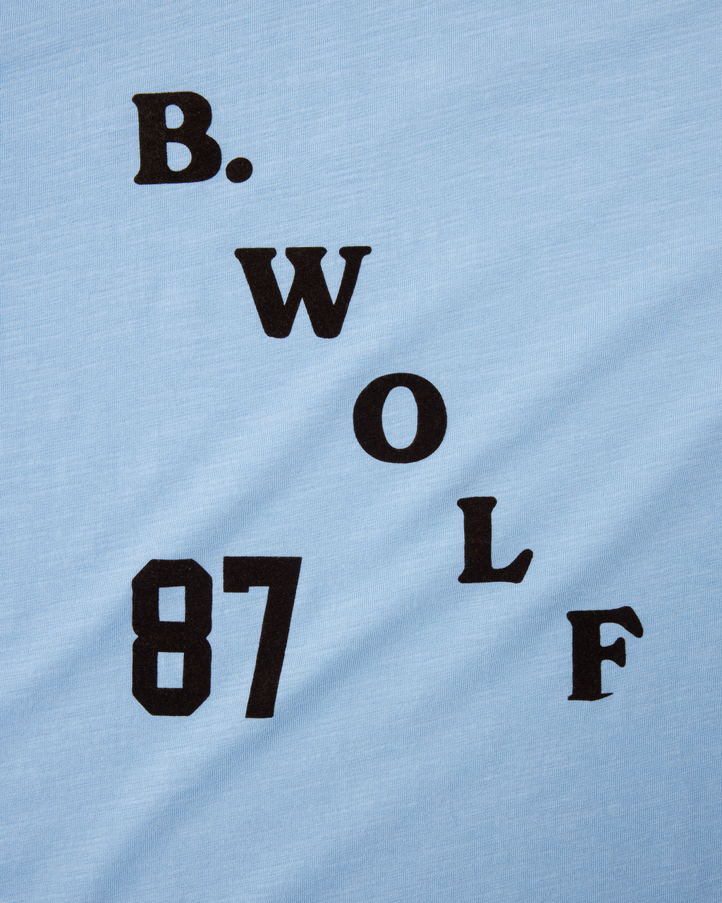 Close up of the raised B.WOLF 87 brown flock print
