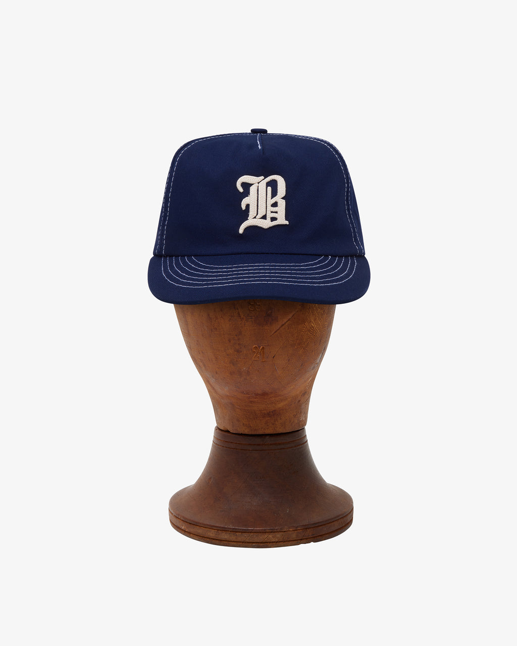 Brotherwolf Calligraphy Cap shown on a hat block
