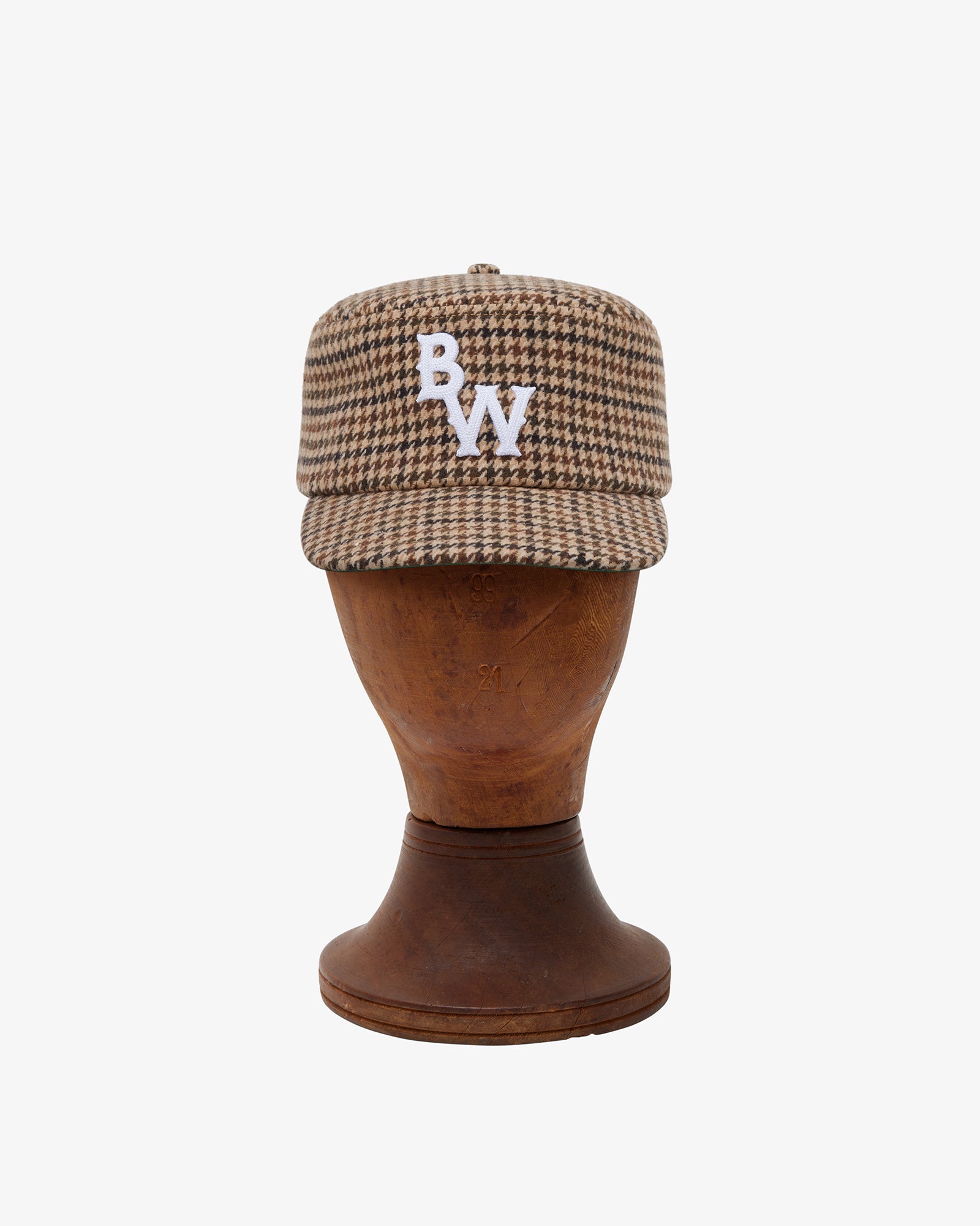 Brotherwolf Pillbox Cap shown on a hat block