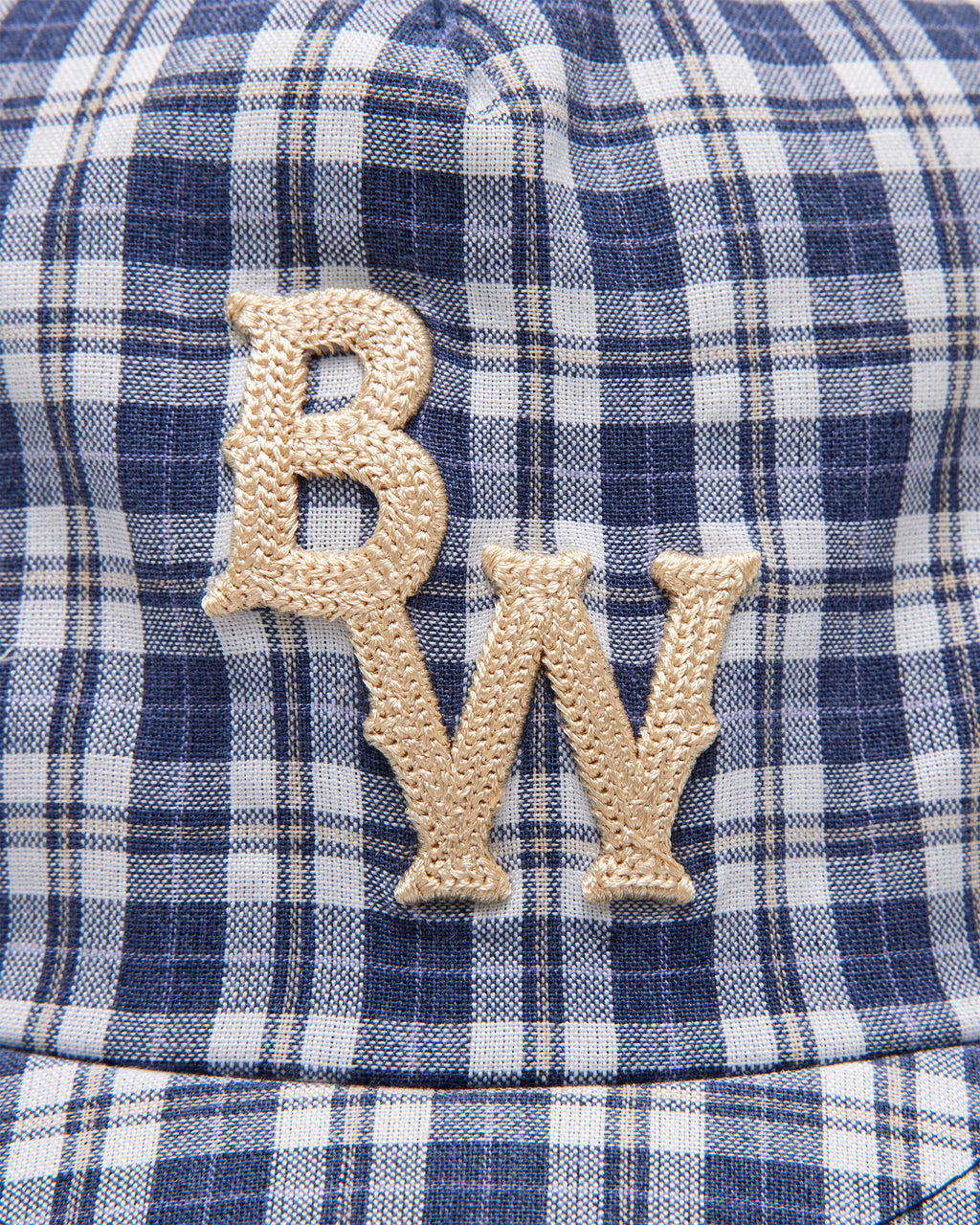 Close up of the chain-stitched BW logo on tartan